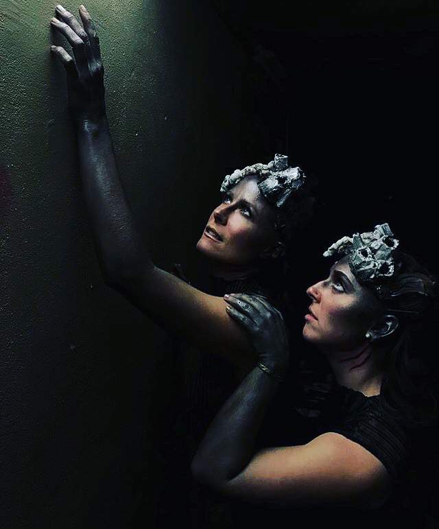 Dancers in full underwater makeup look up. Photo credit Jenn Steigerwald